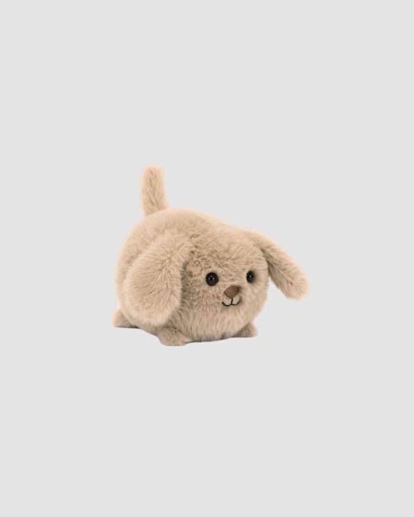 Peluche Caboodle Puppy Jellycat vue de profil, petit chiot en fourrure douce sur fond clair