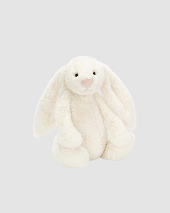 Peluche Bashful Cream Bunny Jellycat en version large sur fond gris clair